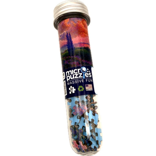 Micro puzzles in a cylindrical tube with colorful packaging on a white background