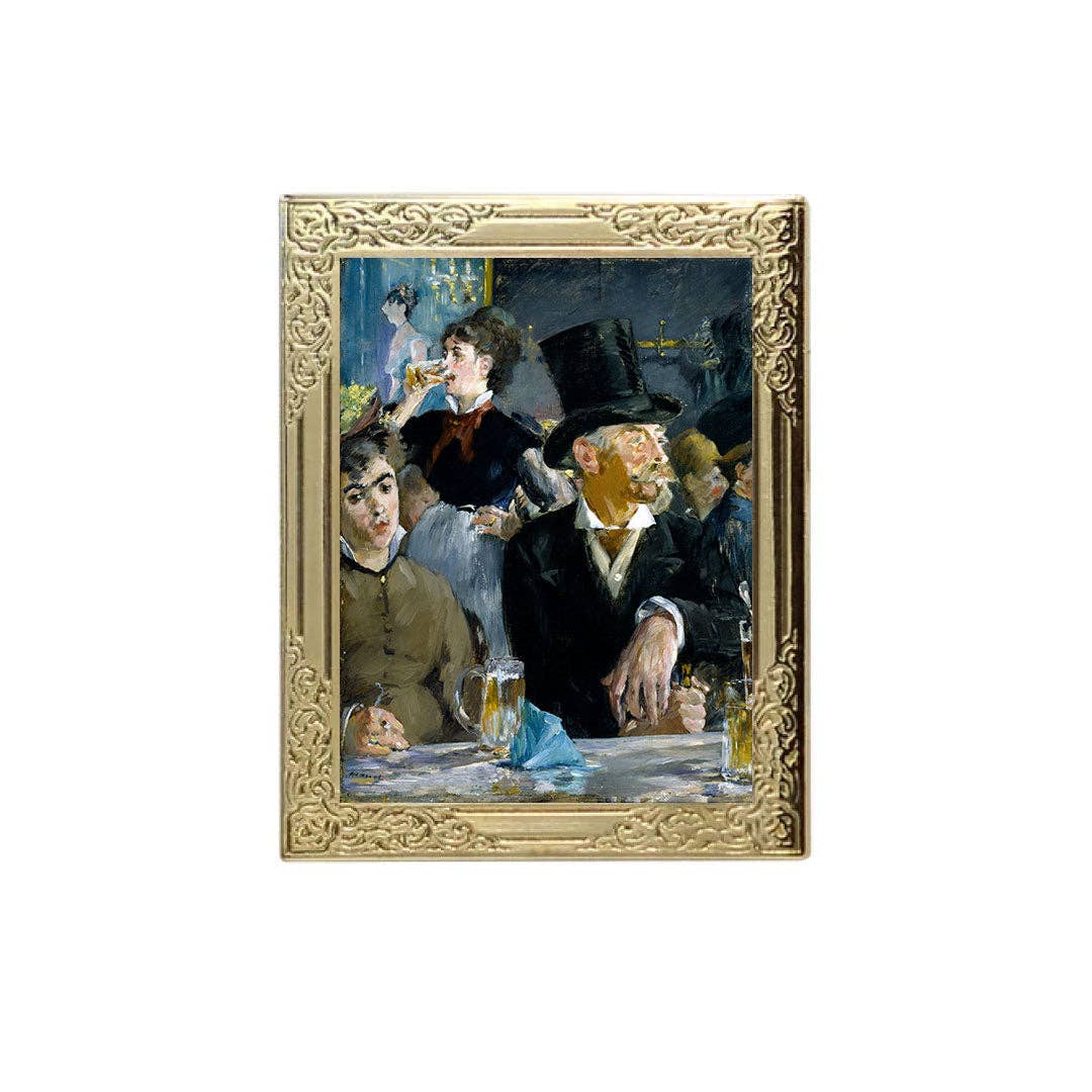 Framed artwork of a social scene with people at a table, featuring a gold ornate frame.