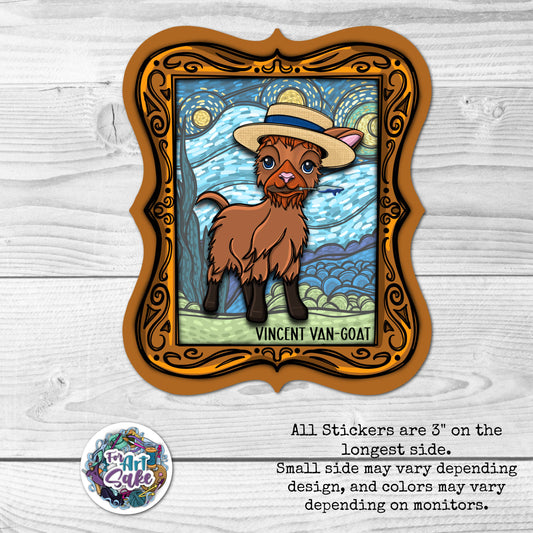 Sticker of a goat wearing a hat with a 'Vincent Van Goat' text, framed on a wooden surface.