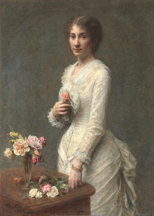Portrait of a woman in a white dress holding flowers, with a vase of flowers on a table in front of her.