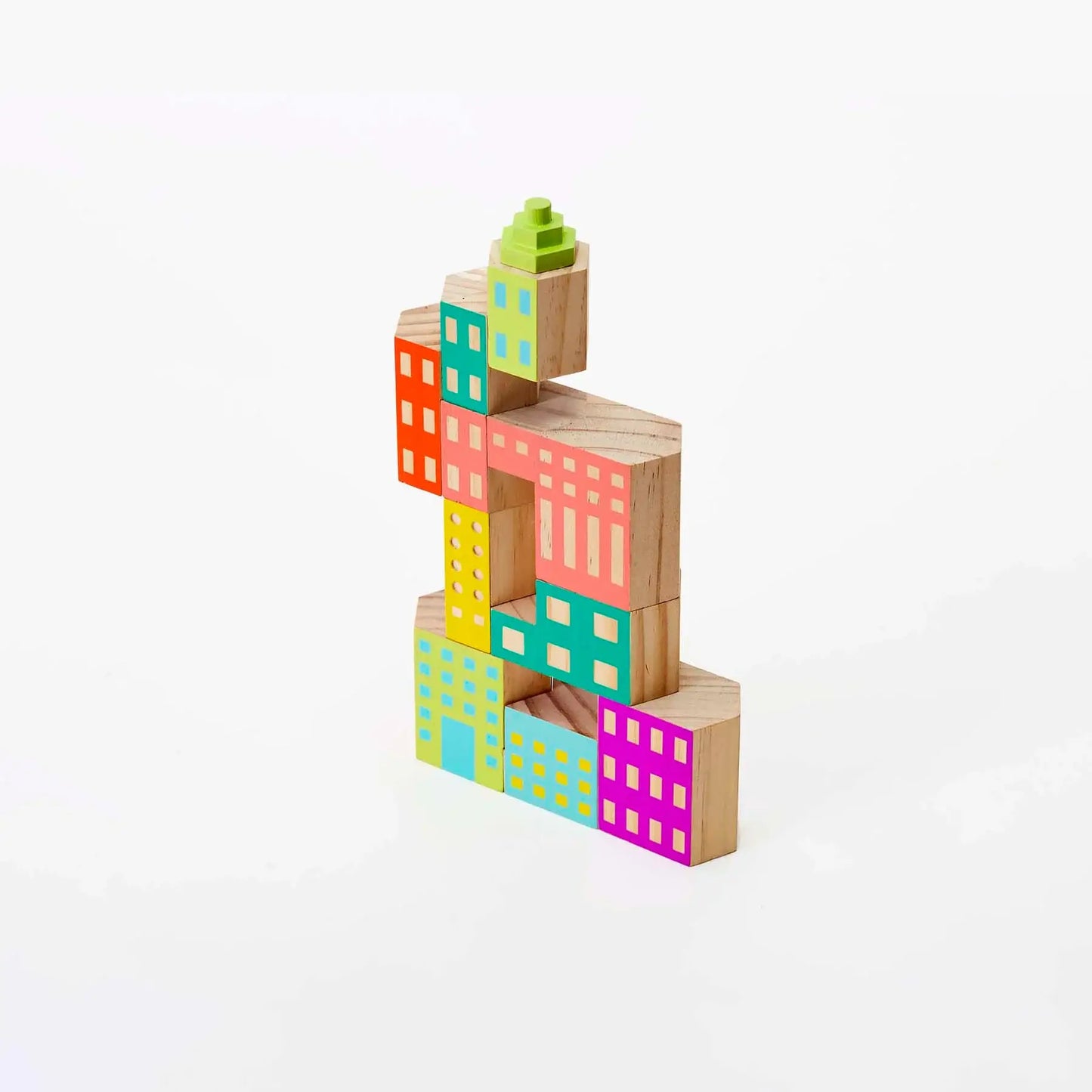 Colorful wooden building blocks stacked on a white background