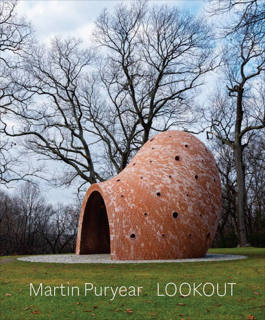 Spherical architectural sculpture in a park with trees and grass
