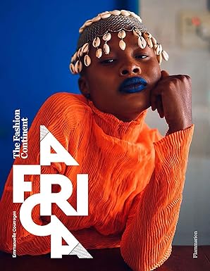 Person wearing an orange outfit with 'AFRICA' text and blue lipstick against a blue background.