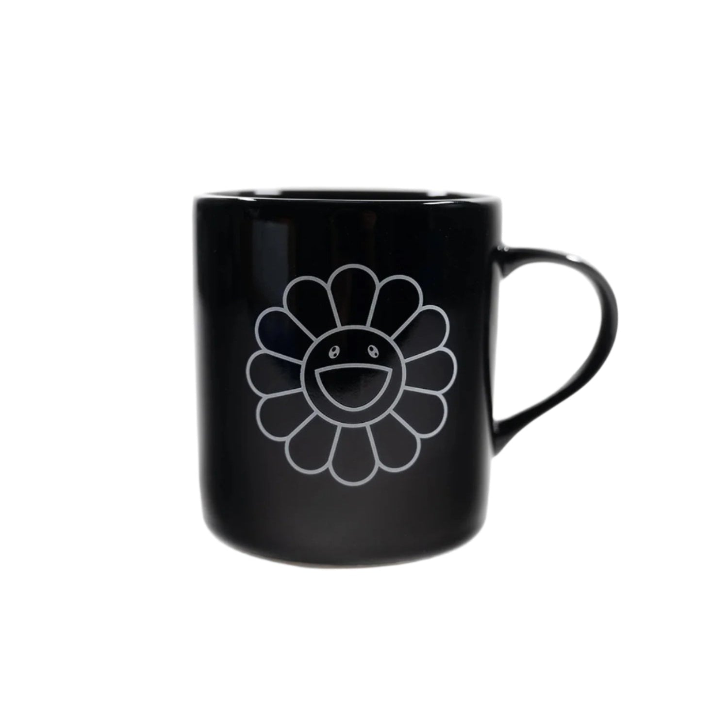 Black mug with a white flower design on a white background