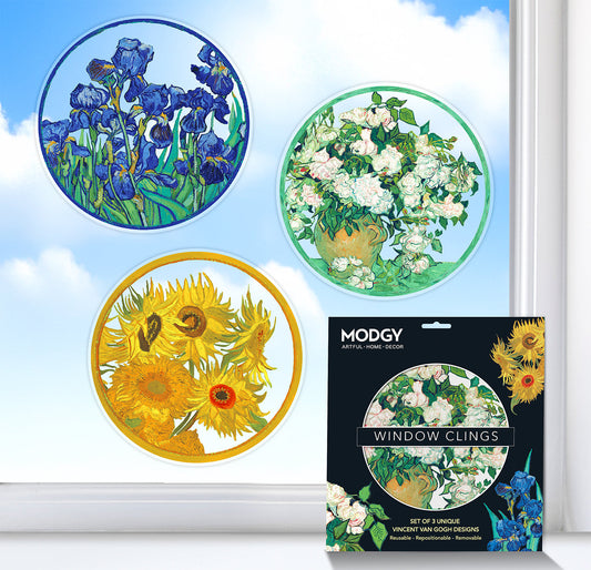 Window clings with floral designs by Van Gogh and their packaging on a window background.