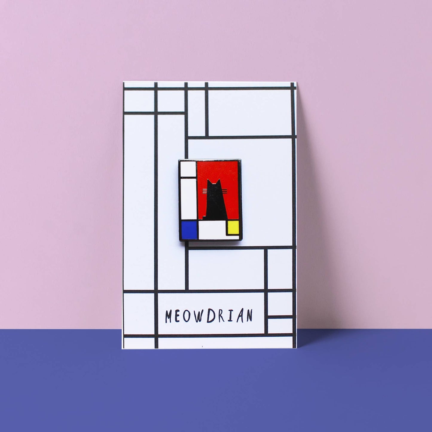 Decorative wall art with geometric design and 'MEOWDRIAN' branding on a pink and blue background